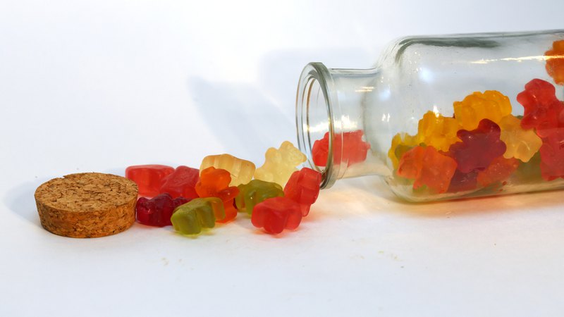 Cannabis gummies in a jar; it’s up to you to choose between Tincture Vs. Gummies