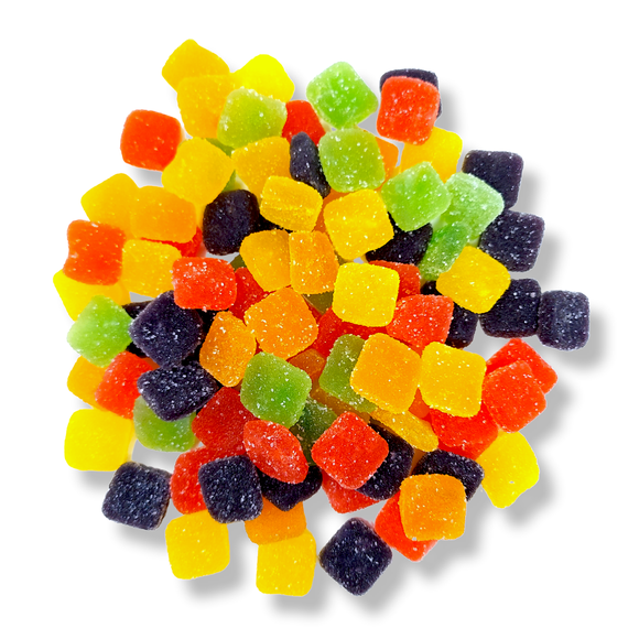 A scattering of THC edibles gummies with mixed fruit flavor
